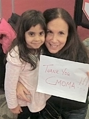 CMomA Grant Recipients, Randi and Pauli with their Thank You CMomA sign
